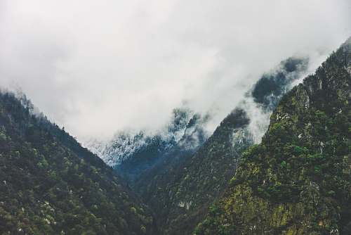 france green mountains with cloudy sky grey