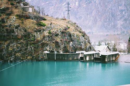 outdoors body of water beside cliff water