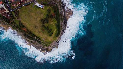 tamarama aerial photo of green island at daytime aerial view