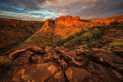 mountain aerial view of rock cliffs under cloudy sky nature