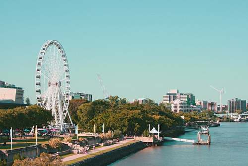 brisbane landscape photography of city near river ferris wheel