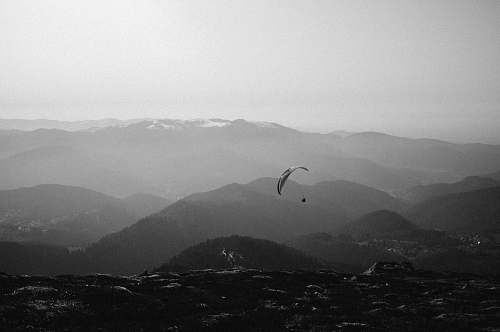 france person doing paragliding grey