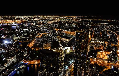 building aerial photography of skyscraper at night time urban
