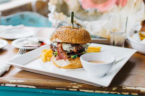 burger brown burger dish on white ceramic plate sandwich