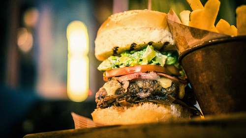burger hamburger with lettuce, cheese, tomato, and ham candle
