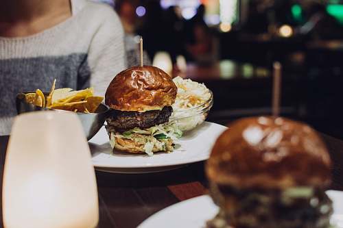 plate selective focus photo of burger burger