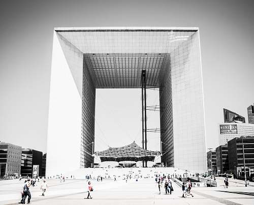 urban grayscale architectural photography of square building architecture