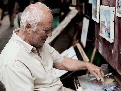 person man painting on canvas paris