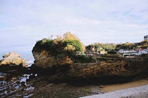 sea rock formation near sea shoreline