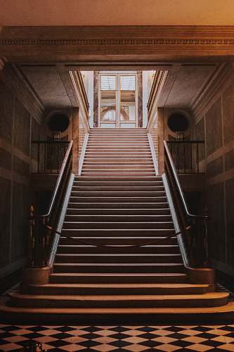 banister empty hallway through staircase handrail
