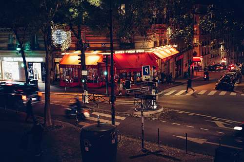 asphalt people in busy city street at night road