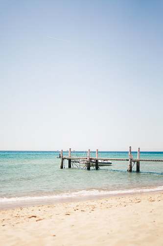 waterfront white and gray wooden dock dock