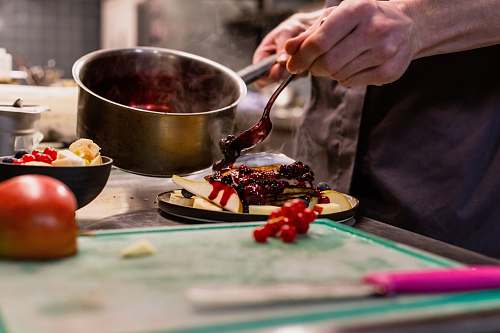 dish person holding stainless steel spoon meal