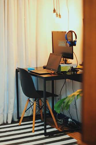 table black wooden office table with laptop and monitor desk