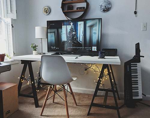 desk flat screen monitor turned on chair