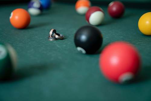 room gold rings surrounded with billiard balls indoors