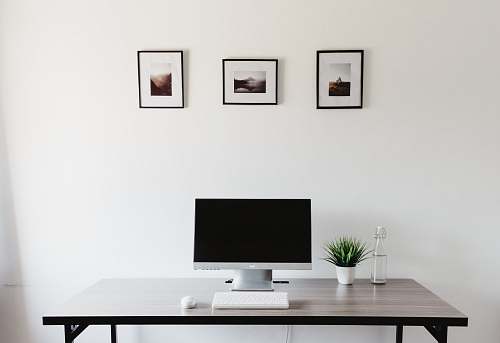 desk monitor, keyboard, and mouse on table table