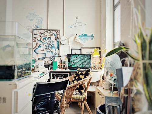 desk turned-on flat screen TV table
