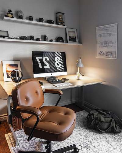 chair turned-on silver iMac table