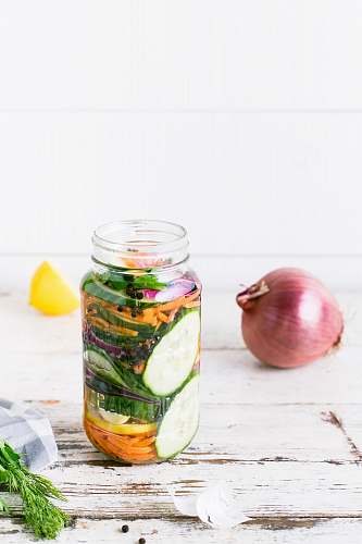food clear glass bottle on white table fruit