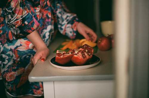 apple person standing beside fruits fruit