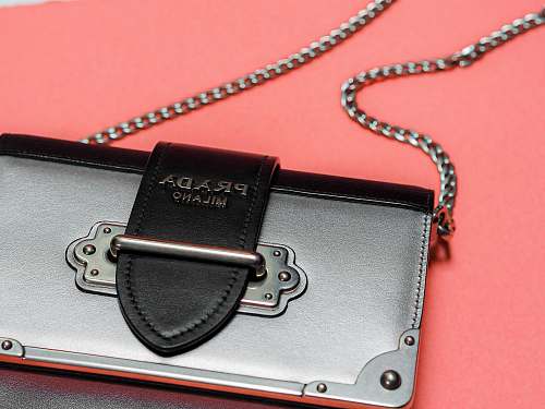 mailand black leather wallet on red surface strap