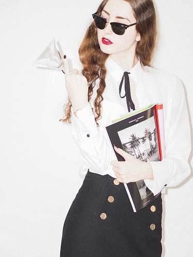 accessories woman in white button up shirt holding white printer paper sunglasses