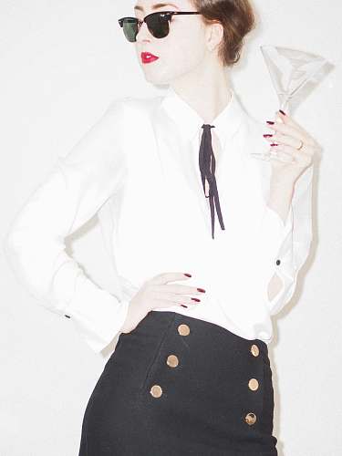 clothing woman in white blazer and black and white polka dot skirt accessories