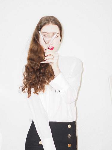 clothing woman in white long sleeve shirt and black pants sleeve