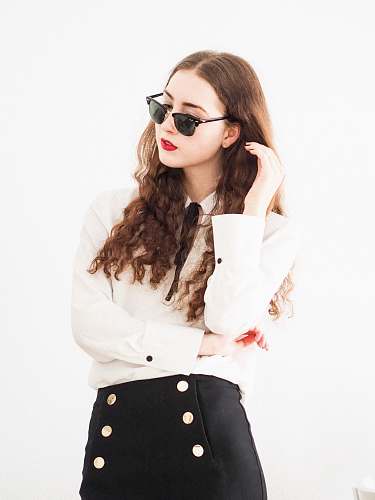 clothing woman in white long sleeve shirt wearing black sunglasses female
