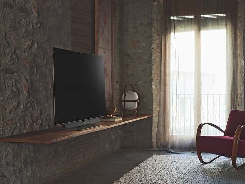 furniture turned-off flat screen television on brown wooden TV stand chair