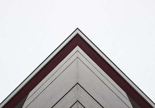 triangle worm's-eye view of white and red building architecture