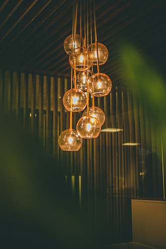 pendant selective focus photography of lit pendant lights hanging