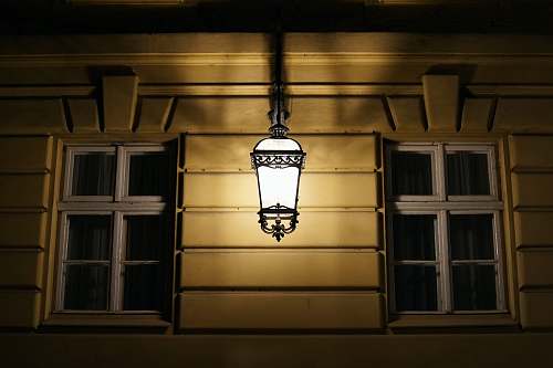 lancut wall sconce beside window pane poland