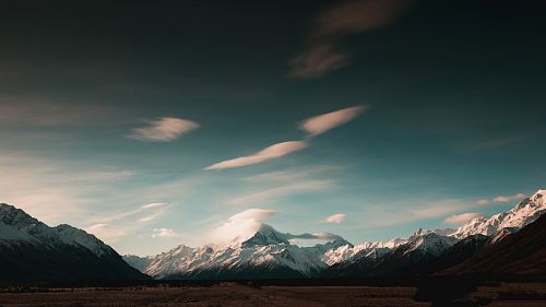gray mountains under gray sky