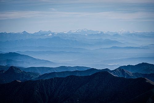 mountains under blue and grey sky