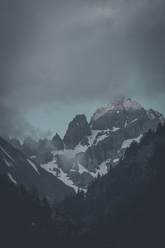 photography of mountain beside forest