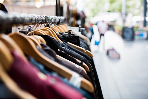 selective focus photography of hanged clothes