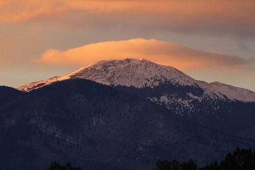 snow covered mountain under white cloudy sky