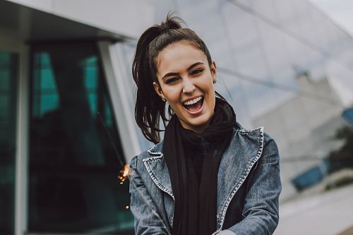 woman wearing gray denim jacket and black scarf