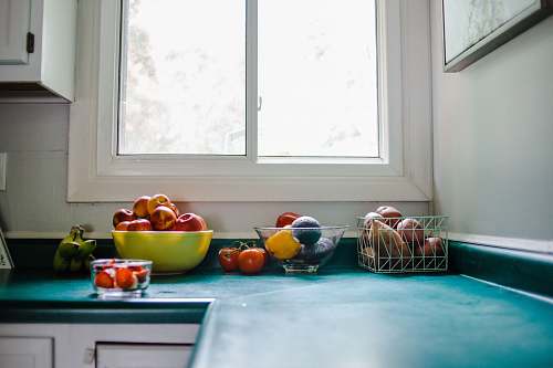 apple bowl of red apple on blue kitchen cabinet bowl