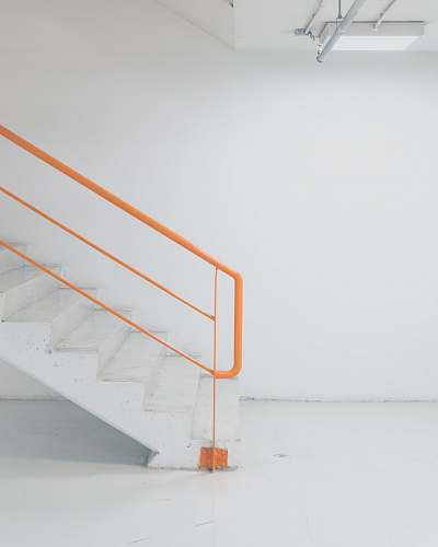 handrail orange metal railing white concrete stairs the mall athens