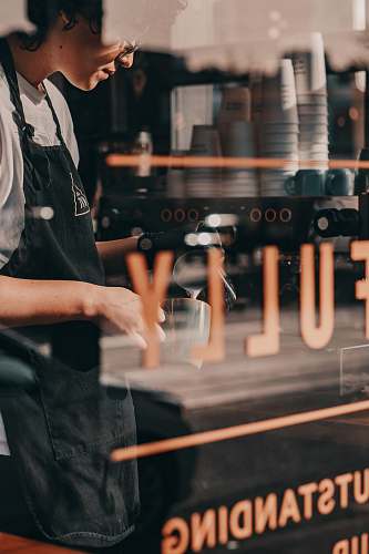 human man wearing black apron the roasted nut