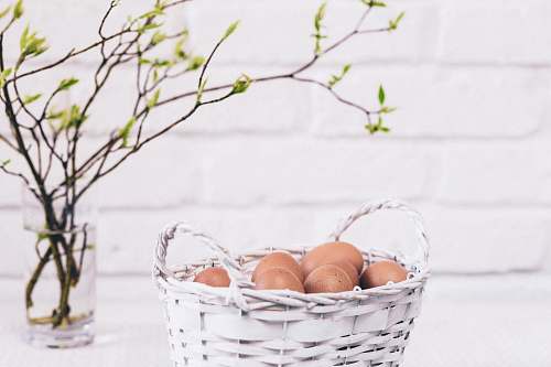 basket brown eggs on white basket blossom