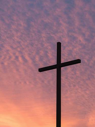cross silhouette of large cross during daytime church