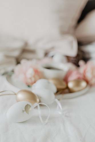 egg white and gold decors on white surface food