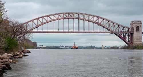 boat about to pass bridge
