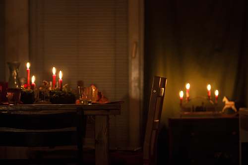 berlin lighted candles on brown wooden table germany