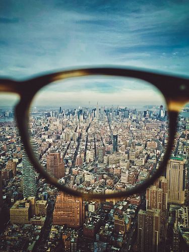 city buildings on eyeglasses view