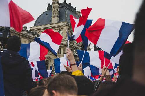 symbol people holding France flag in the street human